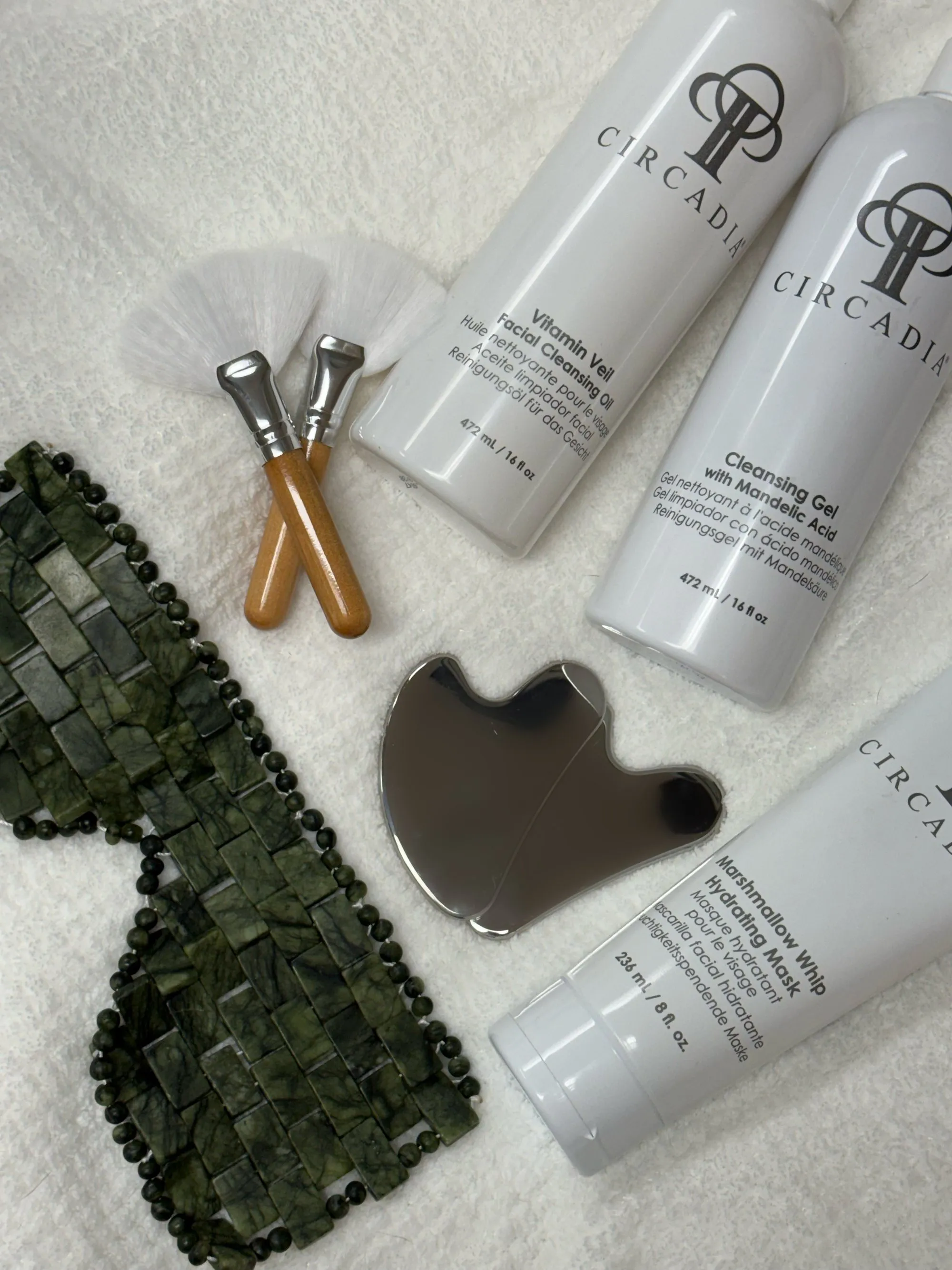 Circadia products with gua sha, jade eye mask, and facial brushes